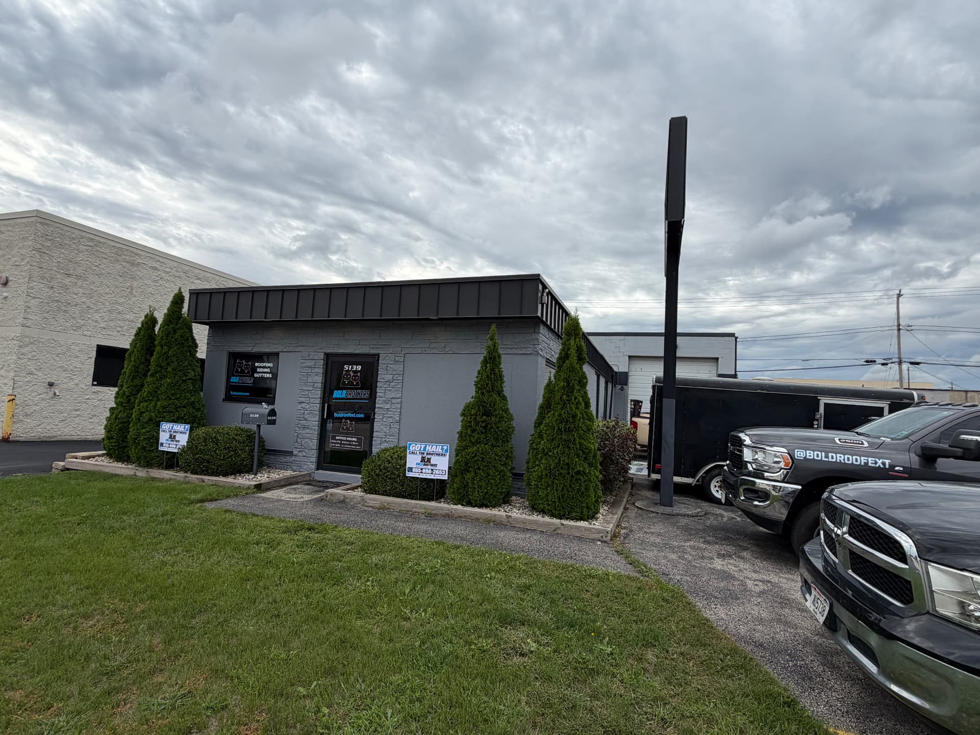 BOLD Brothers Roofing & Exteriors office in Butler, Wisconsin with branded trucks and signage — the next chapter