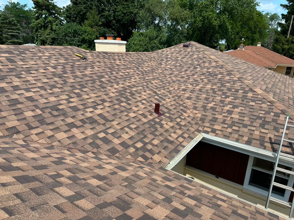Finished architectural shingle roof on a large home