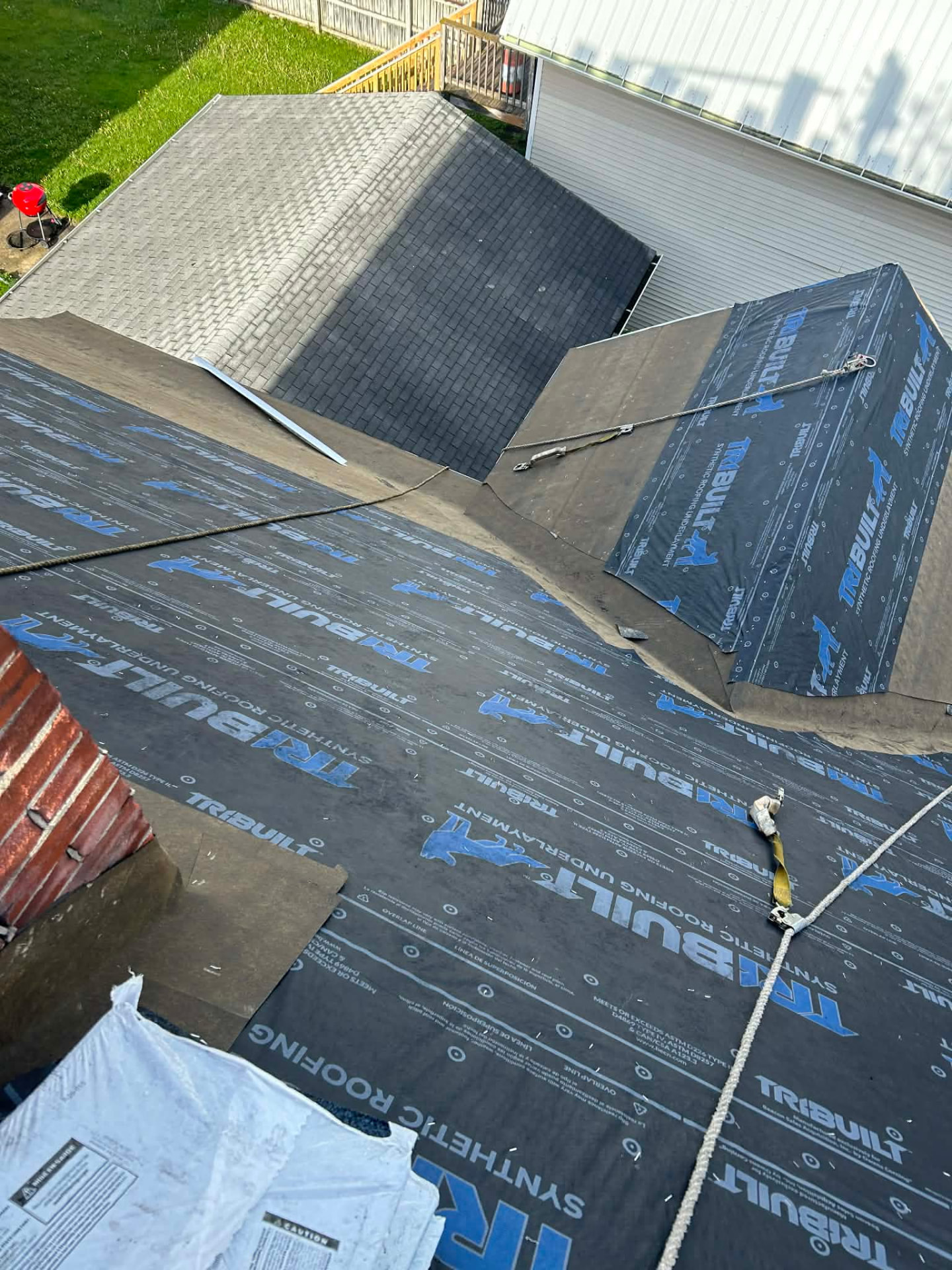 Synthetic underlayment installed across a roof deck