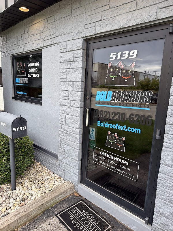 Branded glass entry door of the BOLD Brothers office in Butler, Wisconsin