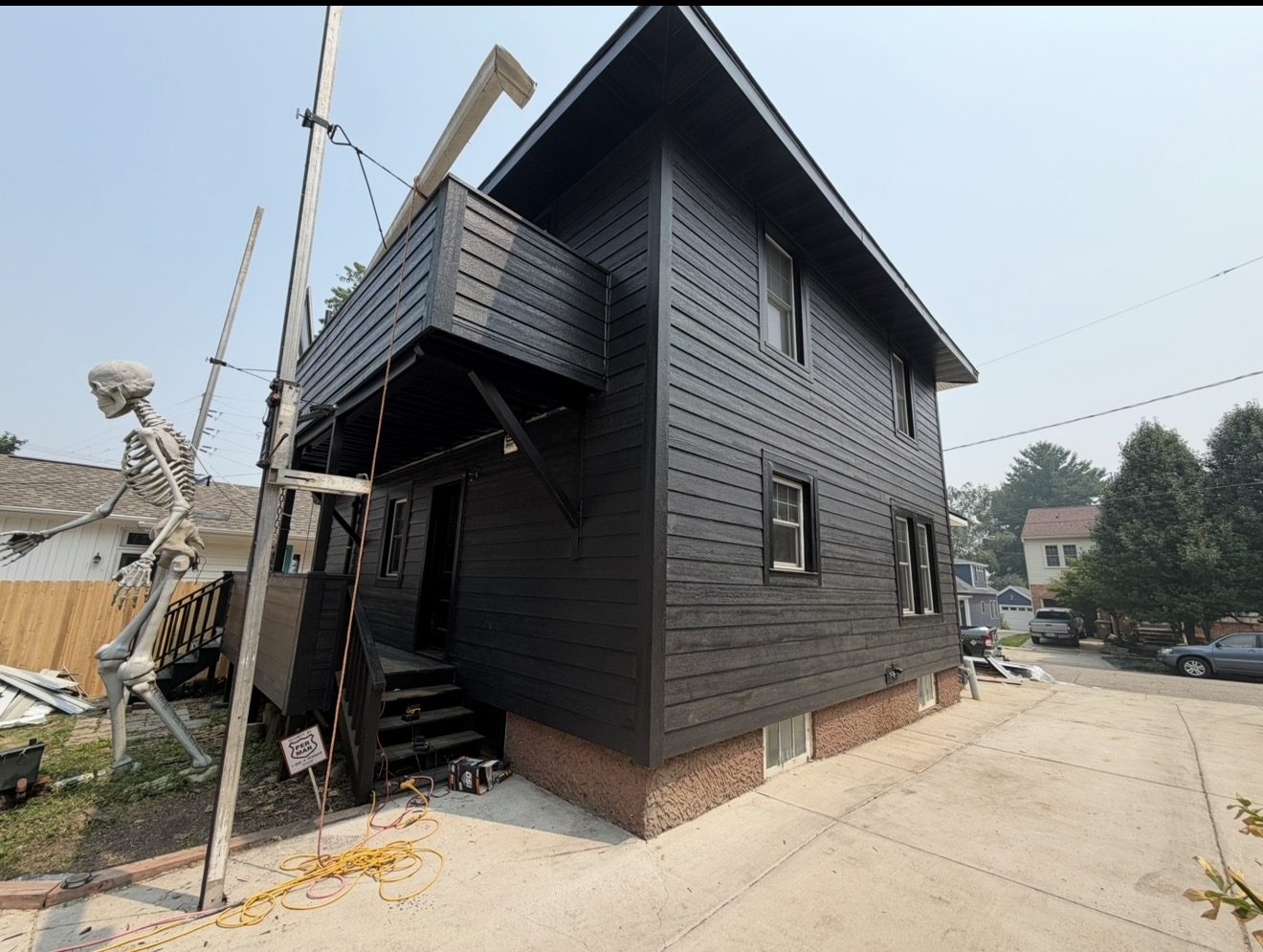 Modern black siding on a two-story home